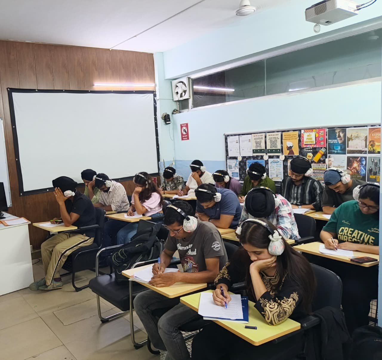 Students taking a mock IELTS Listening test at IELTS Simulator
